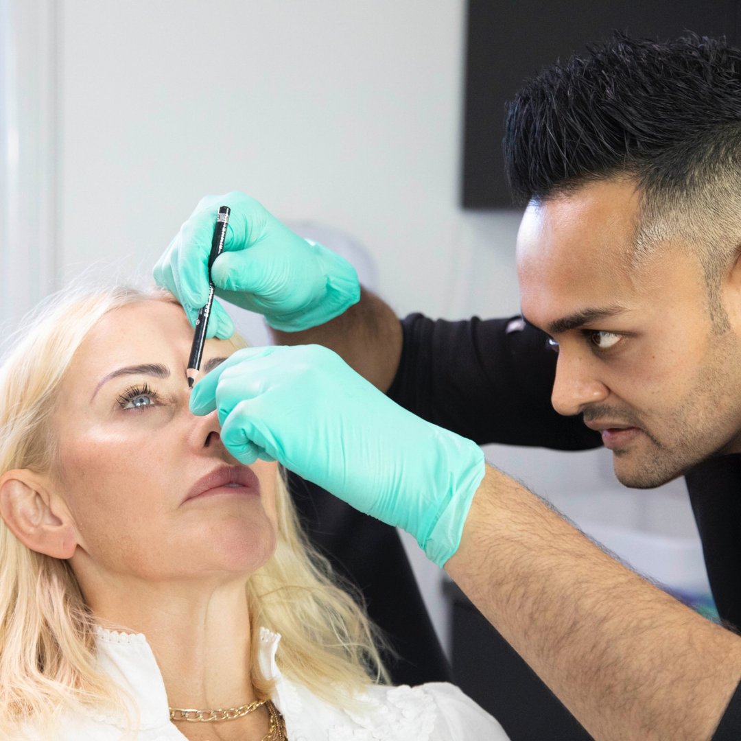 Happy, relaxed client in the treatment chair at Intrigue Cosmetic Clinic having dermal filler injections