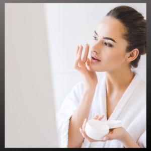 Woman using hydrating cream to combat dry skin 