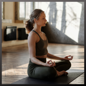 Woman practicing meditation and yoga to beat stress in skin detox